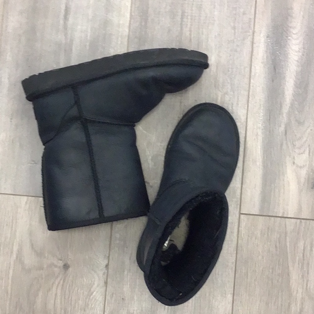 UGG black matte leather boots.